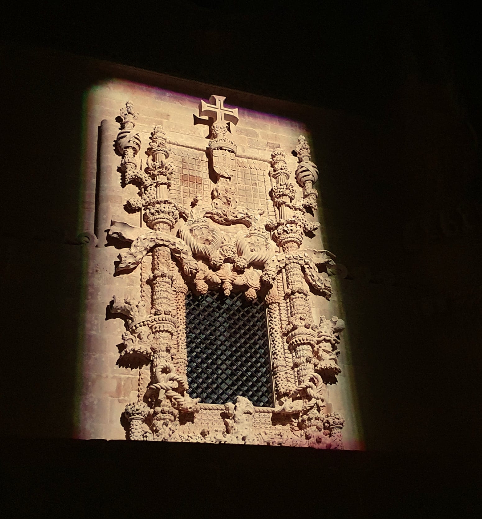 The Manueline window of the Chapter Room at the Convent of Christ during the preliminary lighting trials, the carved stone washed from below.
