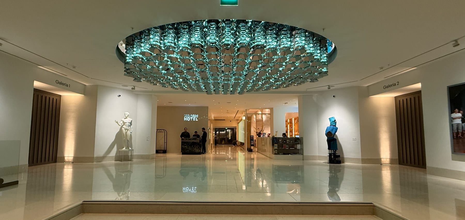 The museum atrium, its coffered ceiling working as the light source.